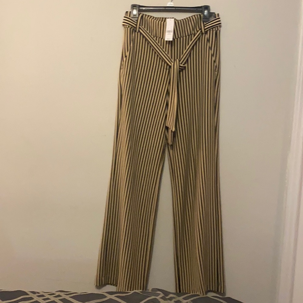 Cream and black striped pants.